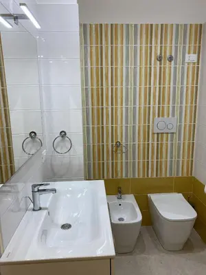 a bathroom with a sink and a toilet at Luce del golfo in Castellammare del Golfo