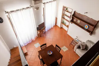 an overhead view of a living room with a table and chairs at Casa Meli dietro Piazza San Domenico by Wonderful Italy in Palermo