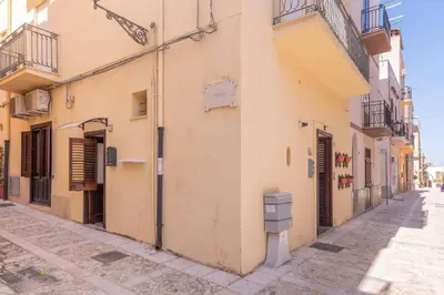 an empty street in an old town at La Casetta di Giò! in Castellammare del Golfo