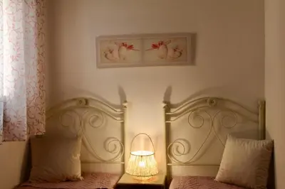 a bedroom with a bed with a lamp on it at Desy Appartamenti in San Vito lo Capo