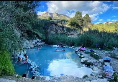 a group of people sitting in a pool of water at Casa Costantino in Alcamo