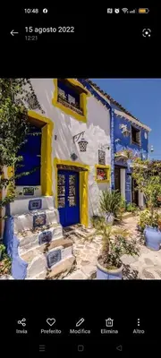 a picture of a building with blue and white at Casa Costantino in Alcamo