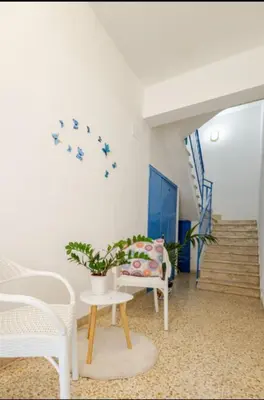 a living room with a table and a couch at Pasqua 2026 già disponibile Dune Home in una Fantastica soluzione con vista mare dalla veranda in Alcamo