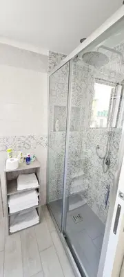 a bathroom with a shower with a glass at Via Roma 35 Apartament in Monreale