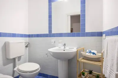 a living room with a couch and a table at Sedie Volanti Apartment with Jacuzzi in Palermo