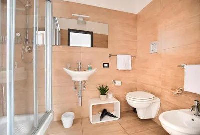 a bathroom with a toilet and a sink and a shower at iFlat Dalla Zia Anna in Palermo