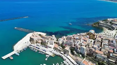 an aerial view of a city with boats in the water at Elima's Mood in Scopello
