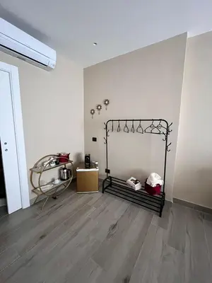 a room with a bed in the corner of a room at CB Rooms in Termini Imerese