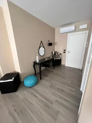 a room with a desk and a mirror on the wall at CB Rooms in Termini Imerese