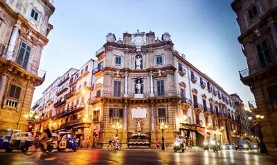 a large building on the side of a street at Casa dei Quattro Canti B&B in Palermo