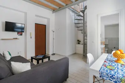 a living room with a couch and a table at Casa dei Quattro Canti B&B in Palermo