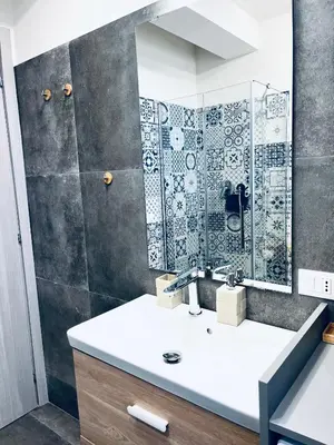 a bathroom with a tub and a sink and a toilet at Casa sulla spiaggia in Castellammare del Golfo
