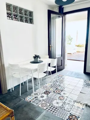 a bathroom with a sink and a mirror at Casa sulla spiaggia in Castellammare del Golfo