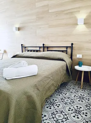 a bedroom with a bed with a towel on it at Casa sulla spiaggia in Castellammare del Golfo