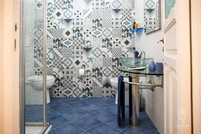 a bathroom with a shower and a toilet and a sink at Ciatu mè in Alcamo