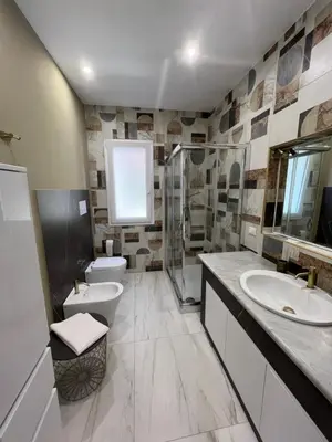 a bathroom with a toilet sink and a shower at Mondello front beach in Palermo