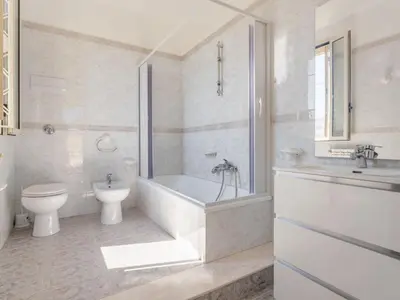 a bathroom with a tub and a toilet and a sink at Holiday Home Alice by Interhome in Ficarazzi
