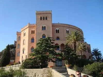 a large building with a tower on top of it at Al Molo 6 in Palermo