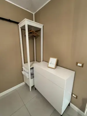 a white refrigerator with a box on top of it at CapoCathedral apartment in Palermo