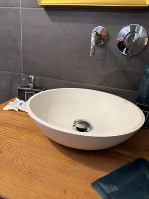 a white sink on top of a wooden table at CapoCathedral apartment in Palermo