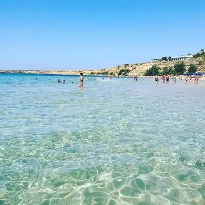 a group of people in the water at a beach at Sea life Terrasini in Terrasini