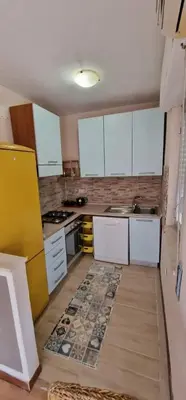 a kitchen with white cabinets and a sink and a stove at Charming house with sea and mountain views in Alcamo in Alcamo