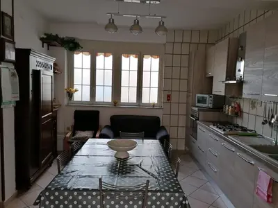 a kitchen with a table with a bowl on it at Le stanze di Anna in Capaci