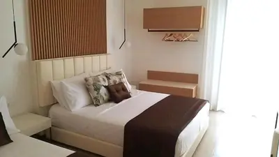 a bedroom with a large bed in a room at Bed and Breakfast Nilu' in Castellammare del Golfo