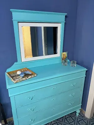 a blue dresser with a mirror on top of it at La casetta della Letizia in Mondello