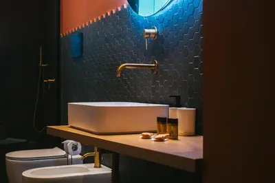a bathroom with a sink and a toilet at MONTESANTO36 APARTMENTS in Palermo