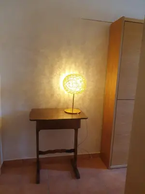 a small lamp on a table in a room at Makari mare in Macari