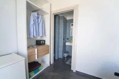 a bathroom with a toilet and a sink at B&b Villa Cusenza in Partinico