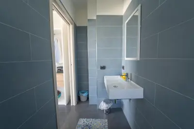 a bathroom with a sink and a mirror at B&b Villa Cusenza in Partinico