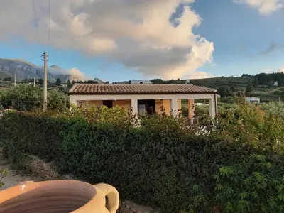 a small house on top of a hill at Villa Noemy in Castellammare del Golfo