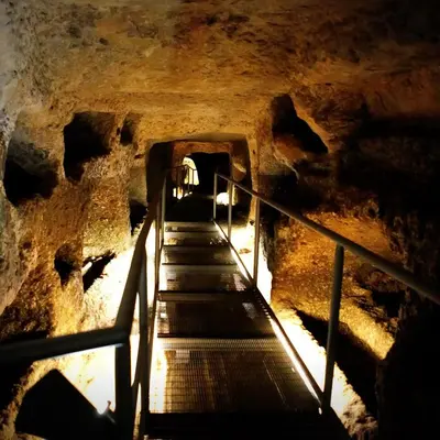 a staircase in a cave with a stair case at IL Rustico di Giò in Carini