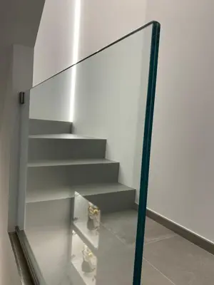 a glass stair case in a building with shoes on it at IL DUCA HOUSE e HOLIDAY PRESTIGE in Caccamo