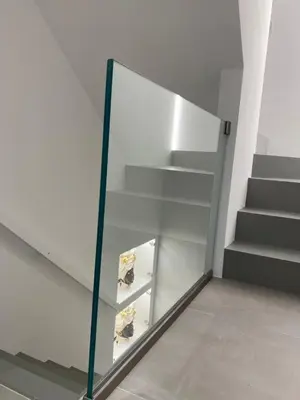 a glass cabinet in a room with stairs at IL DUCA HOUSE e HOLIDAY PRESTIGE in Caccamo
