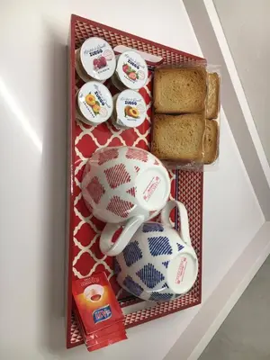a drawer with a tea pot and eggs and bread at Casa di Dada - statua in Palermo