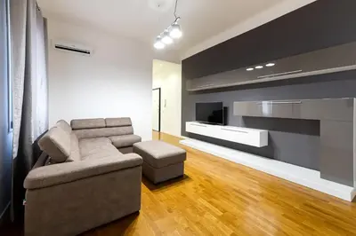a living room with a couch and a television at Casa di Dada - statua in Palermo
