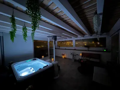 a backyard with a table in the grass at il tramonto in Capaci