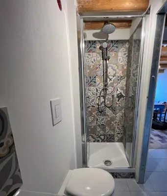 a bathroom with a shower with a toilet in it at Castello a Mare in Castellammare del Golfo