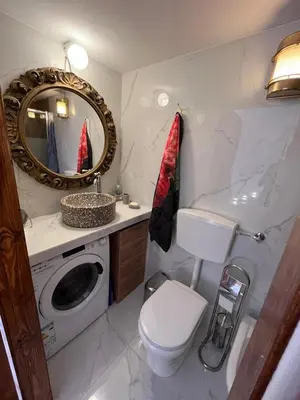 a bathroom with a toilet and a sink and a mirror at Al Vicoletto Boutique in Castellammare del Golfo