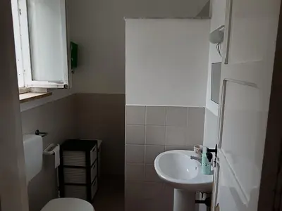 a small bathroom with a sink and a toilet at VILLA CHIARA 200 MT DA MARE SPIAGGIA LIBERA SABBIA in Capaci