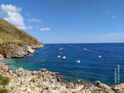 a group of people swimming in the ocean at CasaAntonietta in Alcamo