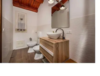 a bathroom with a sink and a toilet at Villa Mirò in Castellammare del Golfo