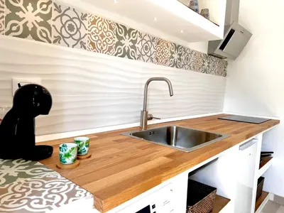a kitchen with a sink and a counter top at Villa di Nera Apartments in Palermo