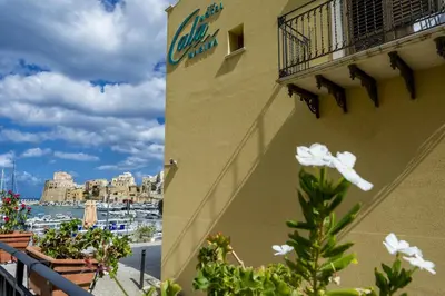 a sign on the side of a building with a marina at Hotel Cala Marina in Castellammare del Golfo