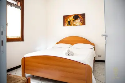 a bedroom with a bed with two stuffed animals on it at CIATU ME' Brezza Marina in Castellammare del Golfo