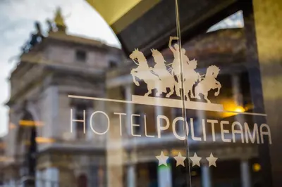 a hotel sign in front of a building at Hotel Politeama in Palermo