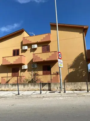 a no parking sign in front of a building at Casa Vacanza Accetta in Trappeto